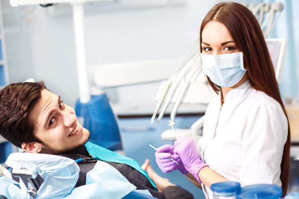 man in dental room getting root canal therapy