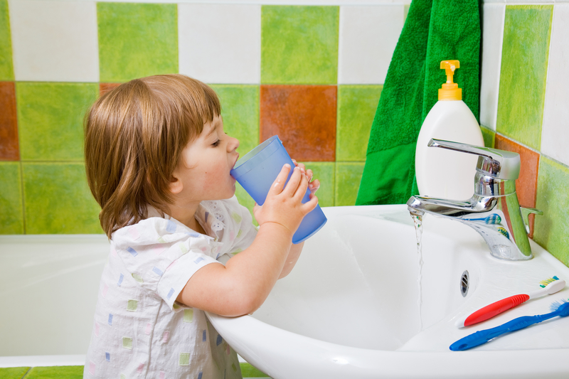 child brushing teeth