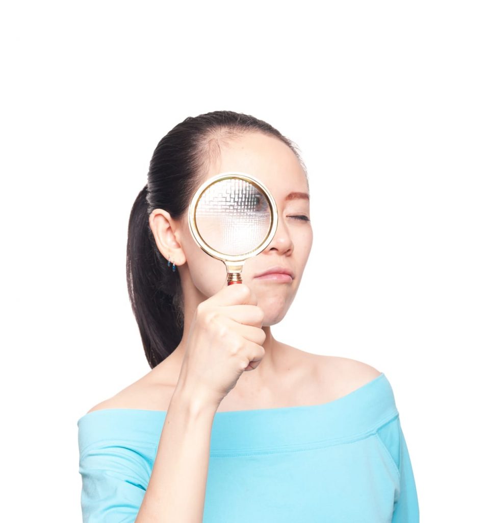woman with magnifying glass