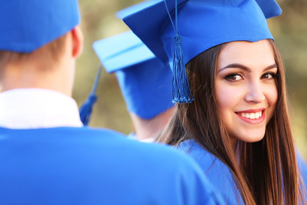 female graduate smiling