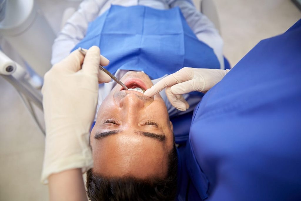sedated man during dental appointment