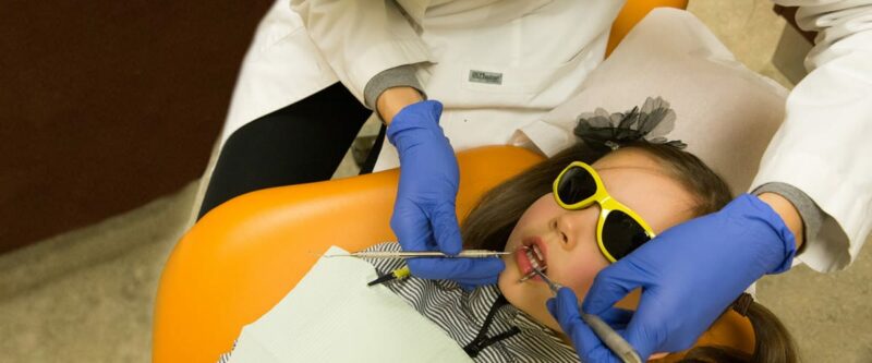 girl getting a dental exam