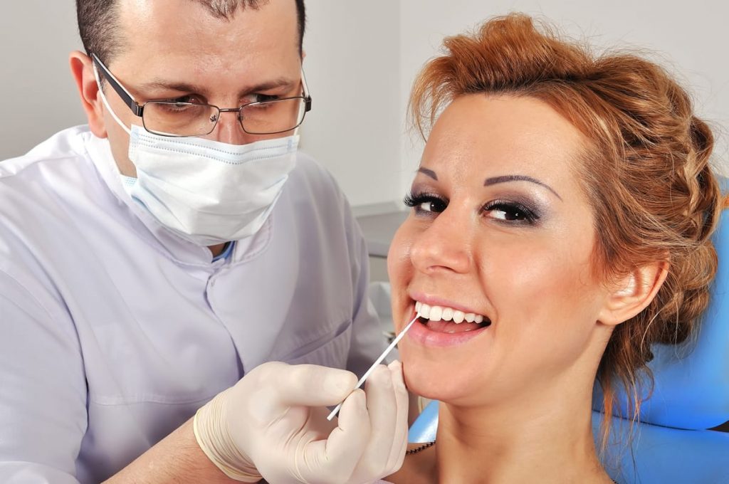 woman getting teeth whitening at Calgary dental clinic