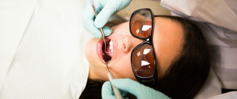 woman getting a dental cleaning