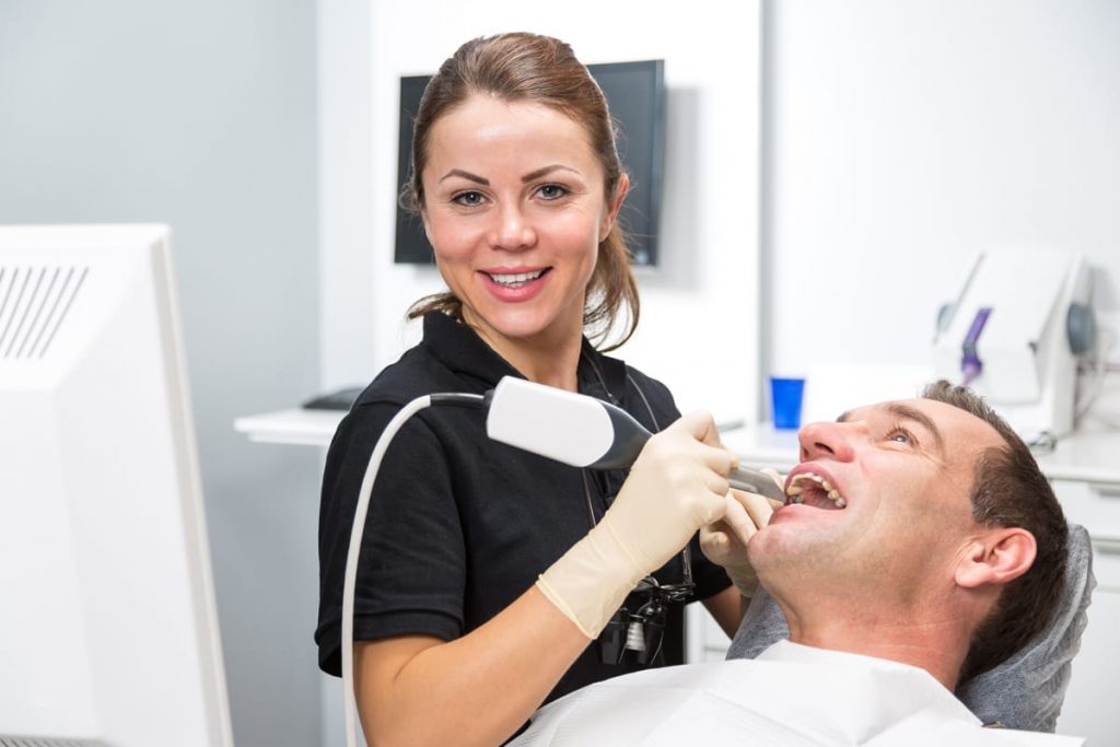 Calgary dentist giving patient a filling