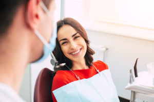 woman smiling at the dentist office