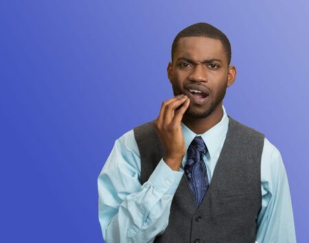 Man in pain with a broken tooth