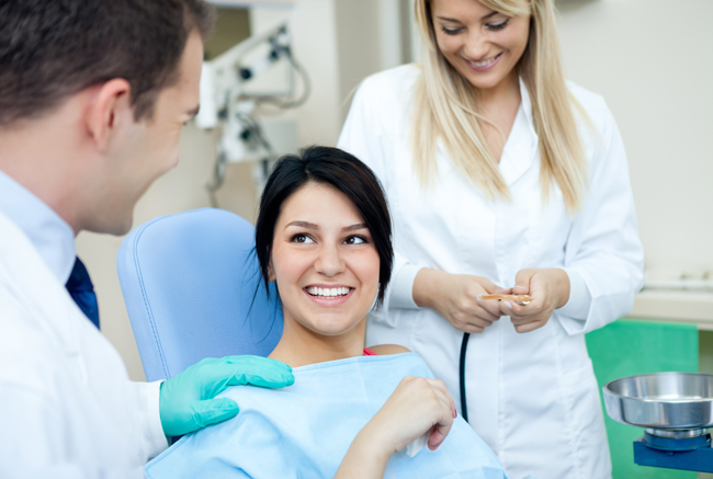 woman in dentist chair getting iv sedation